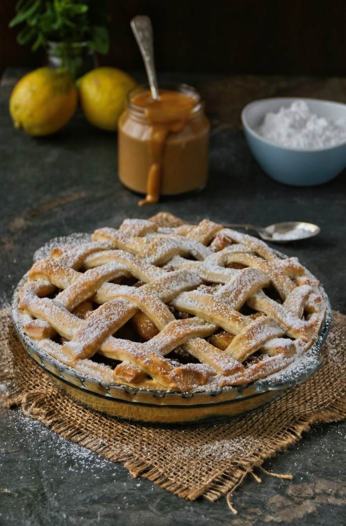 Apple pie with lattice crust and creamy caramel custard. 