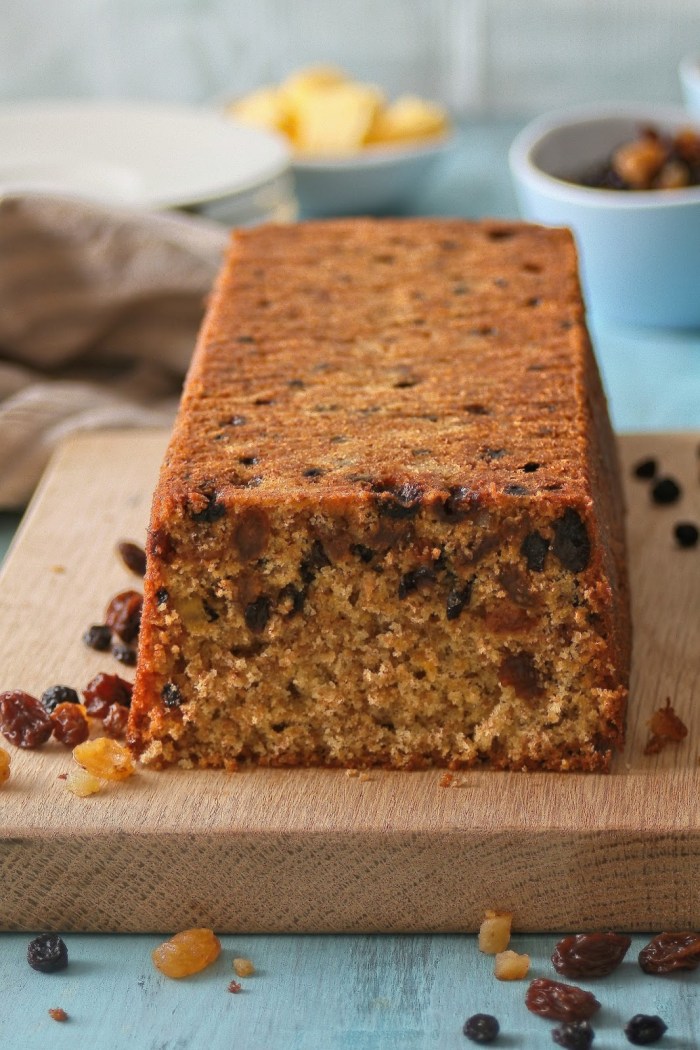 Close up shot of loaf cake with bran and dried fruit. 