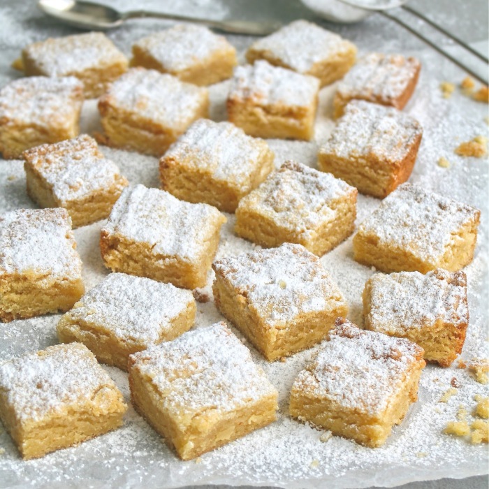 Blocks of almond tart dusted with icing sugar.
