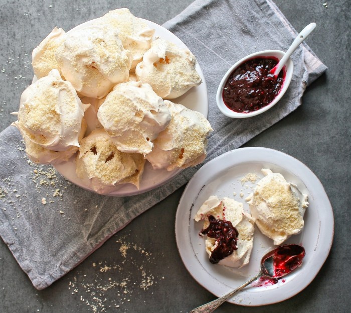 Vanilla meringues with berries. Vanilla bean meringues with ground almonds and berry sauce.