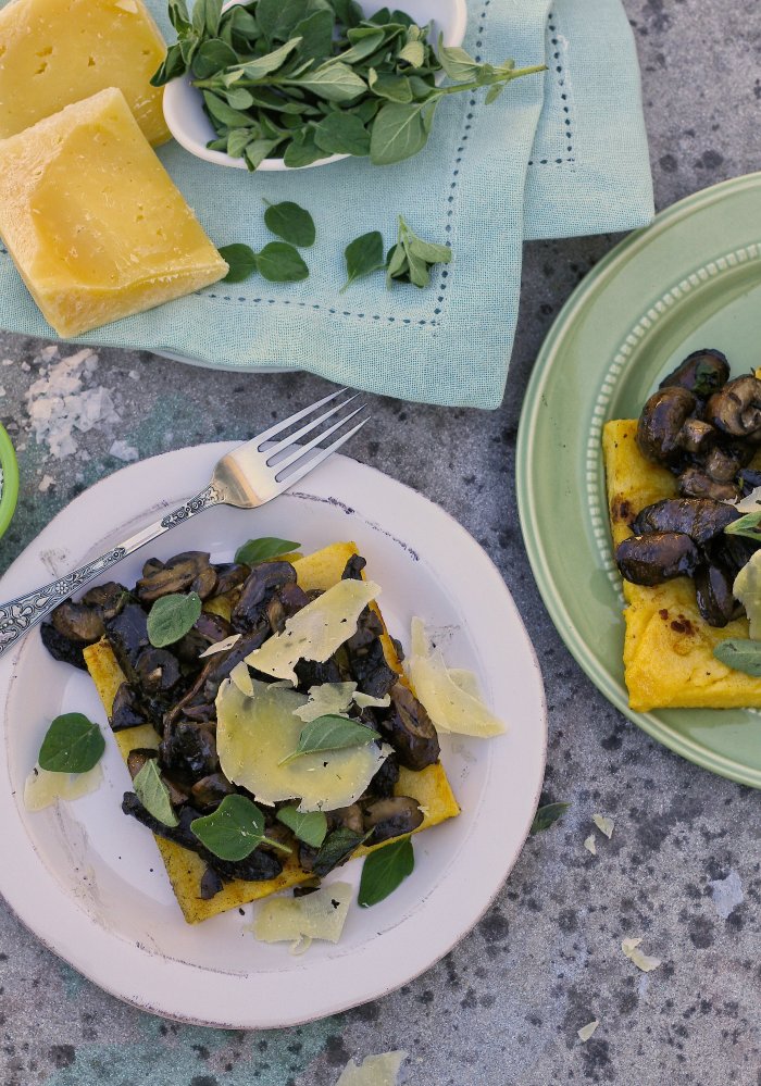Polenta topped with mushrooms and cheese