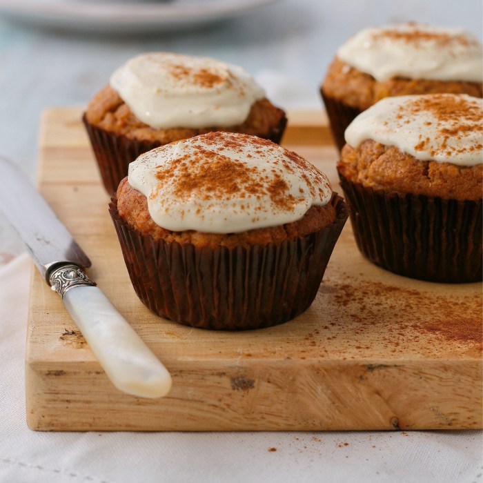 Date, carrot and apple muffins with cream cheese topping. 