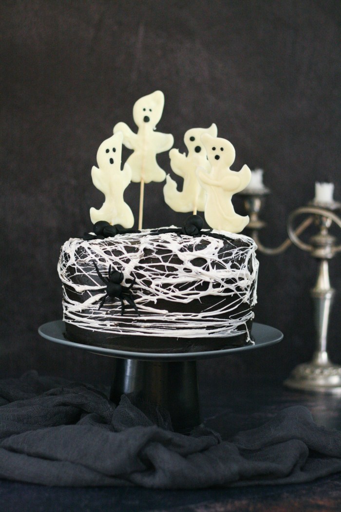 Spider web red velvet cake with chocolate cream cheese icing and chocolate ghosts