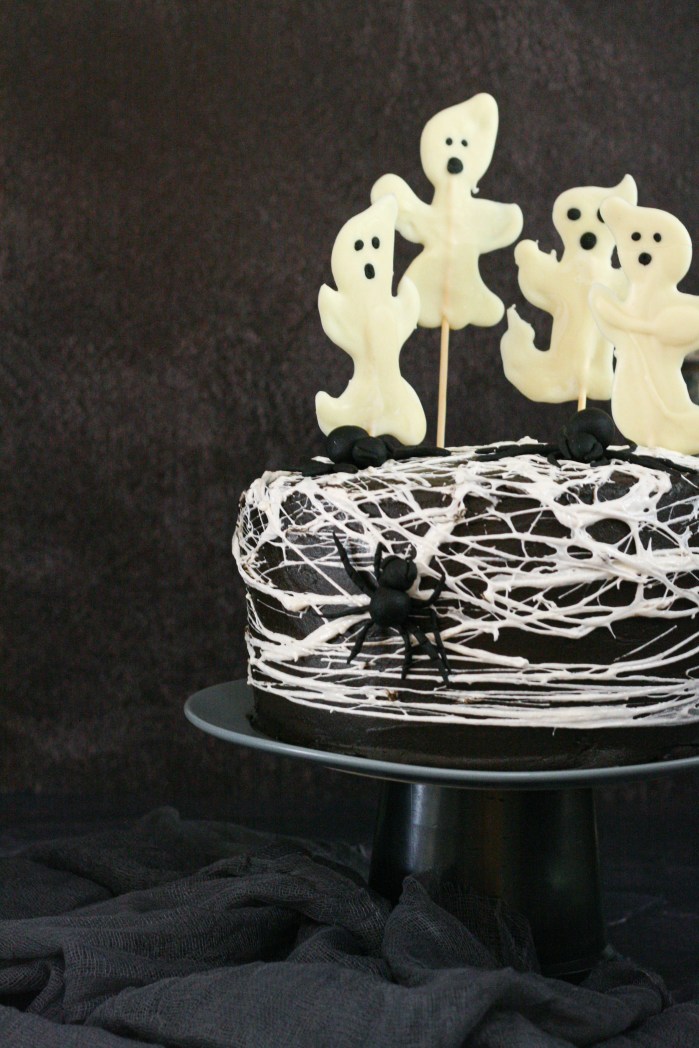 Spider web red velvet cake with chocolate cream cheese icing and chocolate ghosts