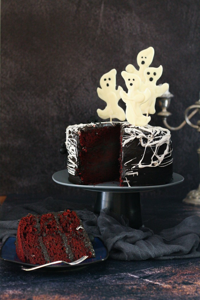 Spider web red velvet cake with chocolate cream cheese icing and chocolate ghosts