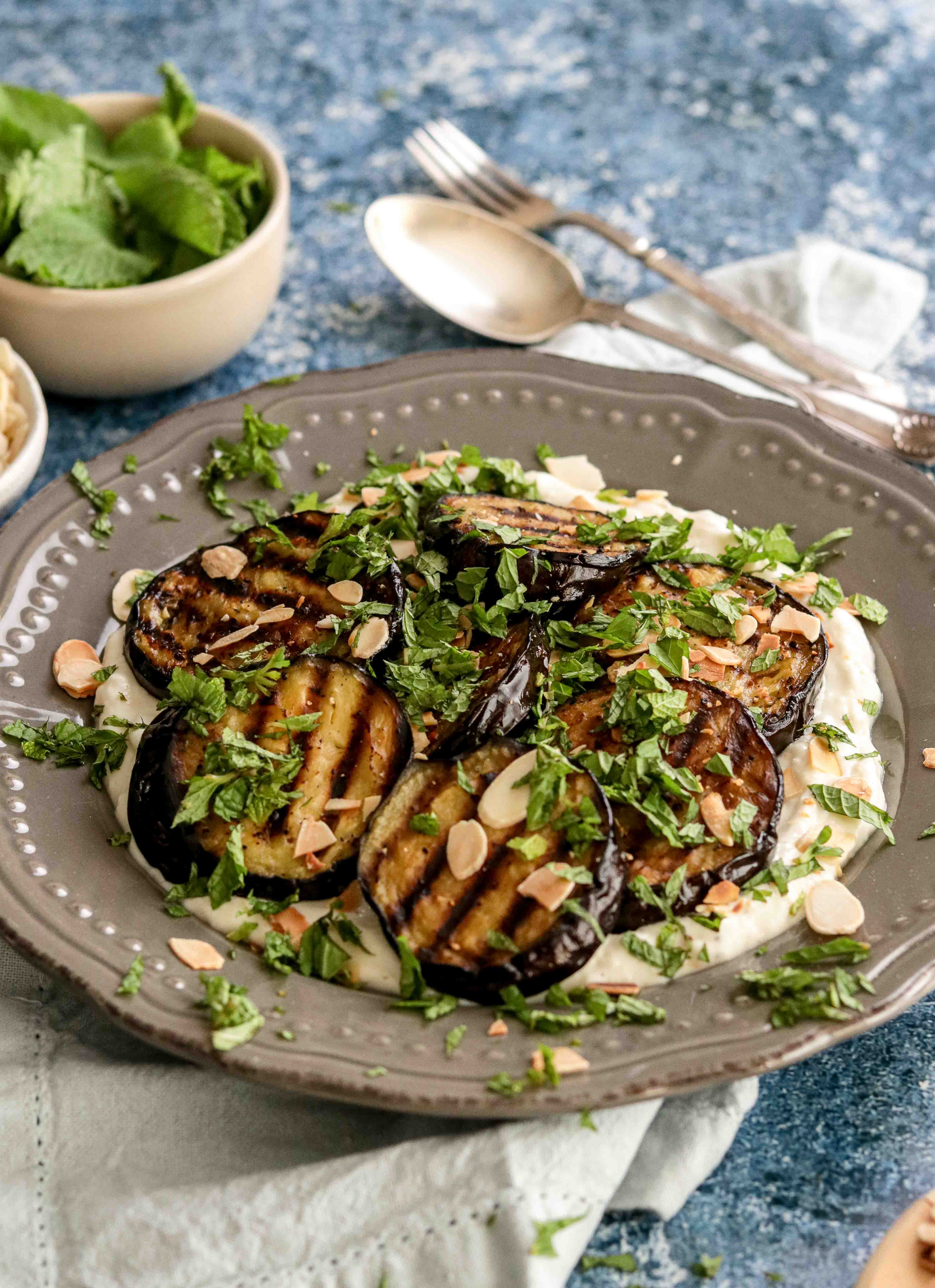 Plate of grilled aubergine with yoghurt