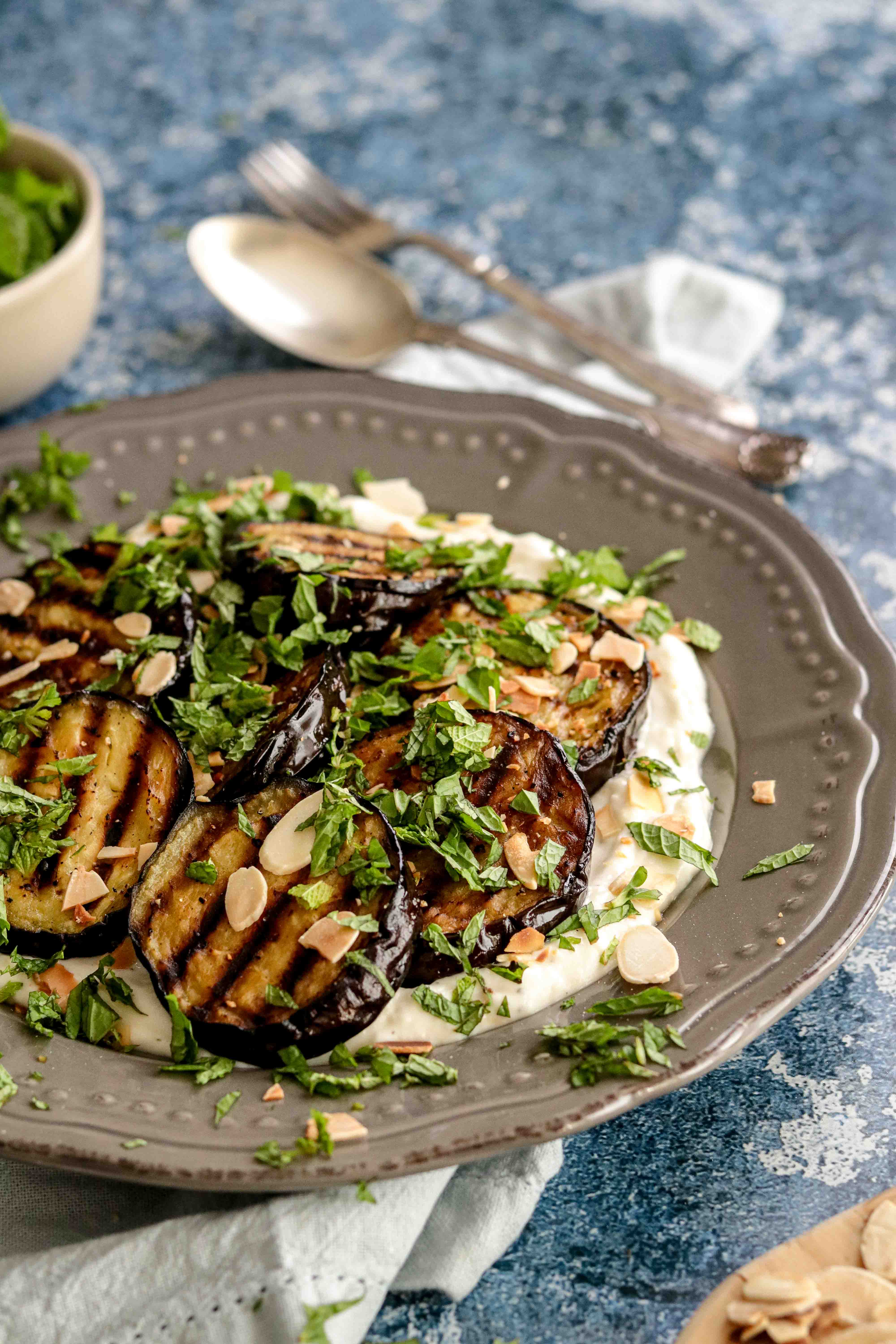 Plate of grilled aubergine with yoghurt