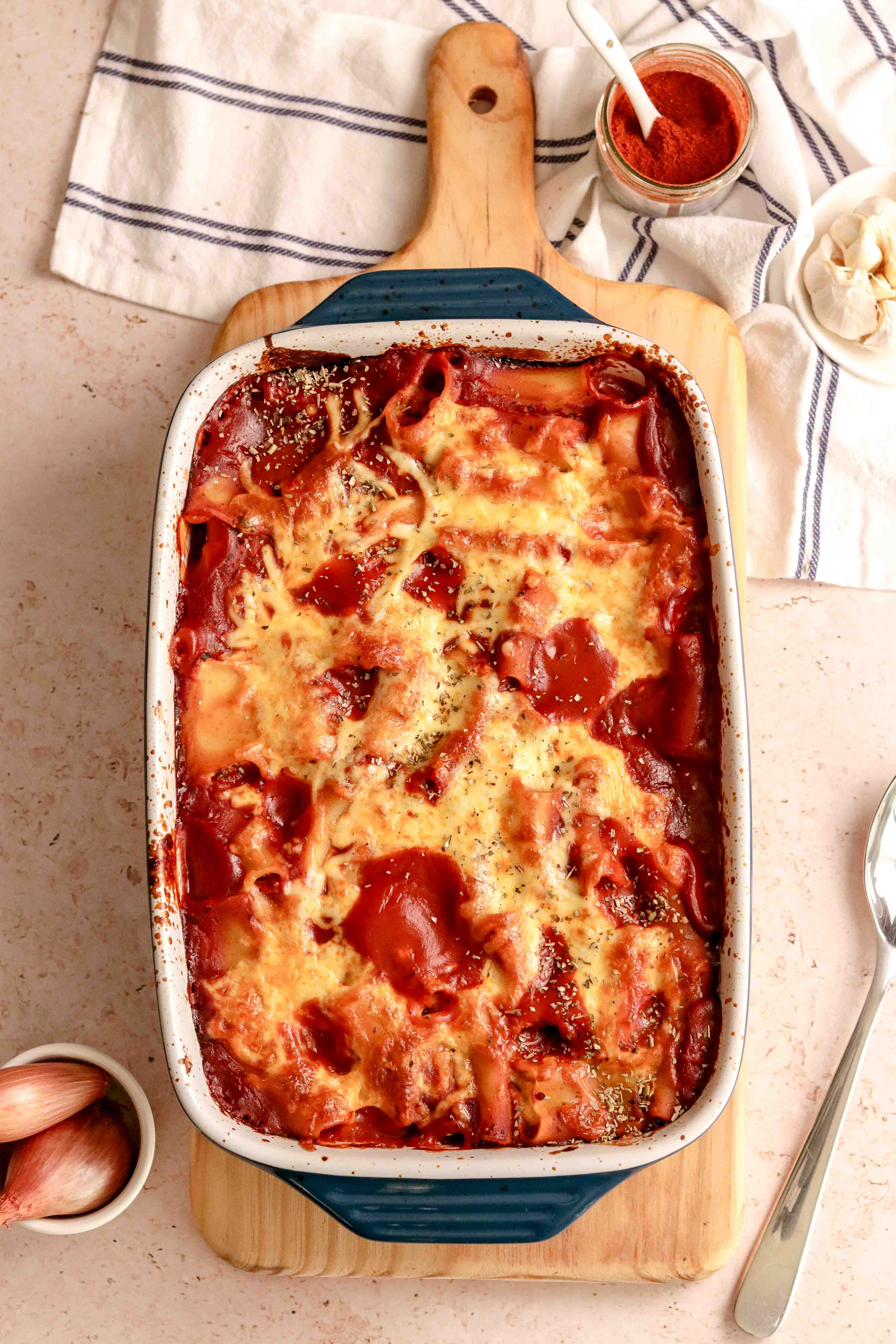 A tray of stuffed pasta in tomato sauce