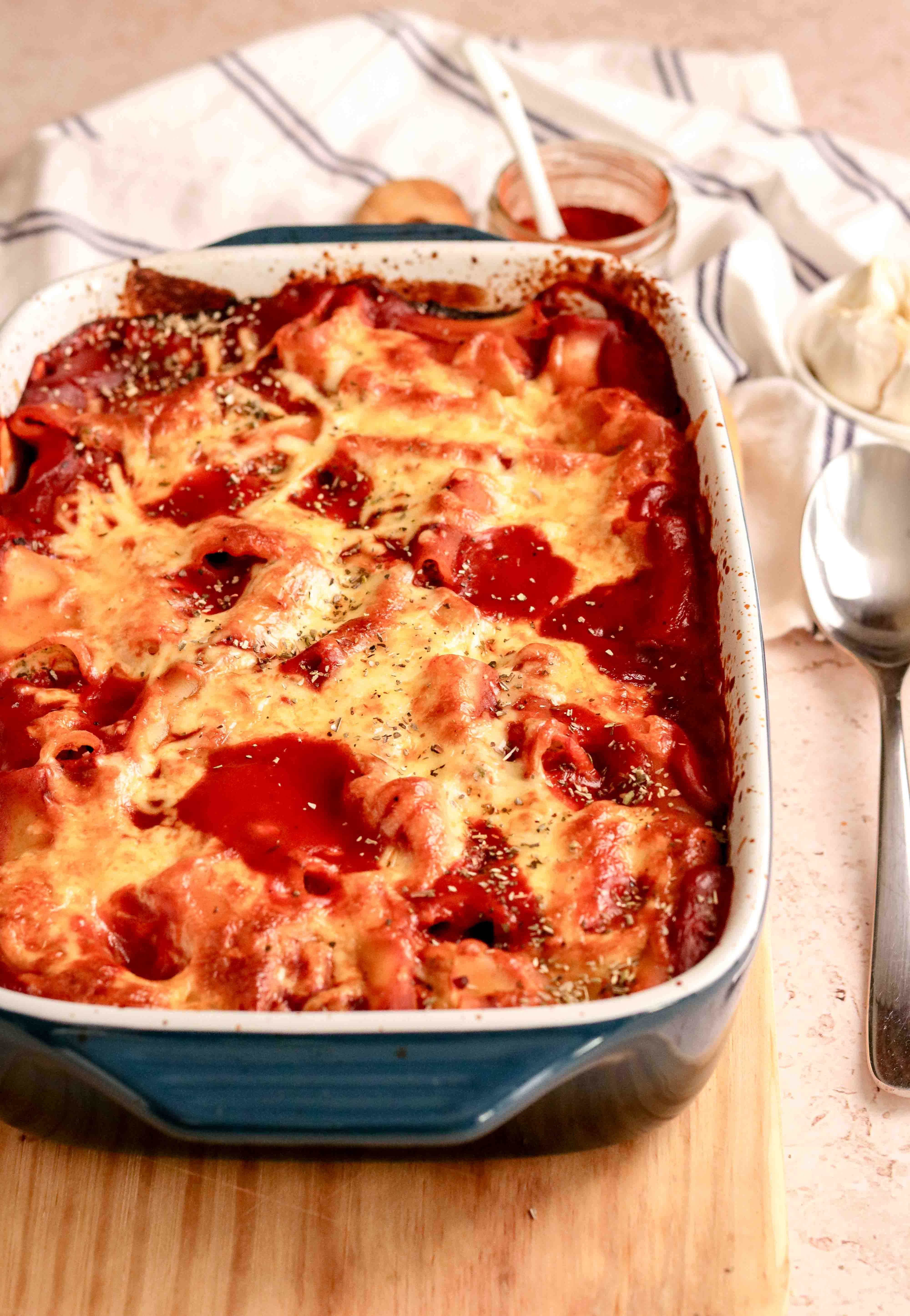 A tray of stuffed pasta in tomato sauce