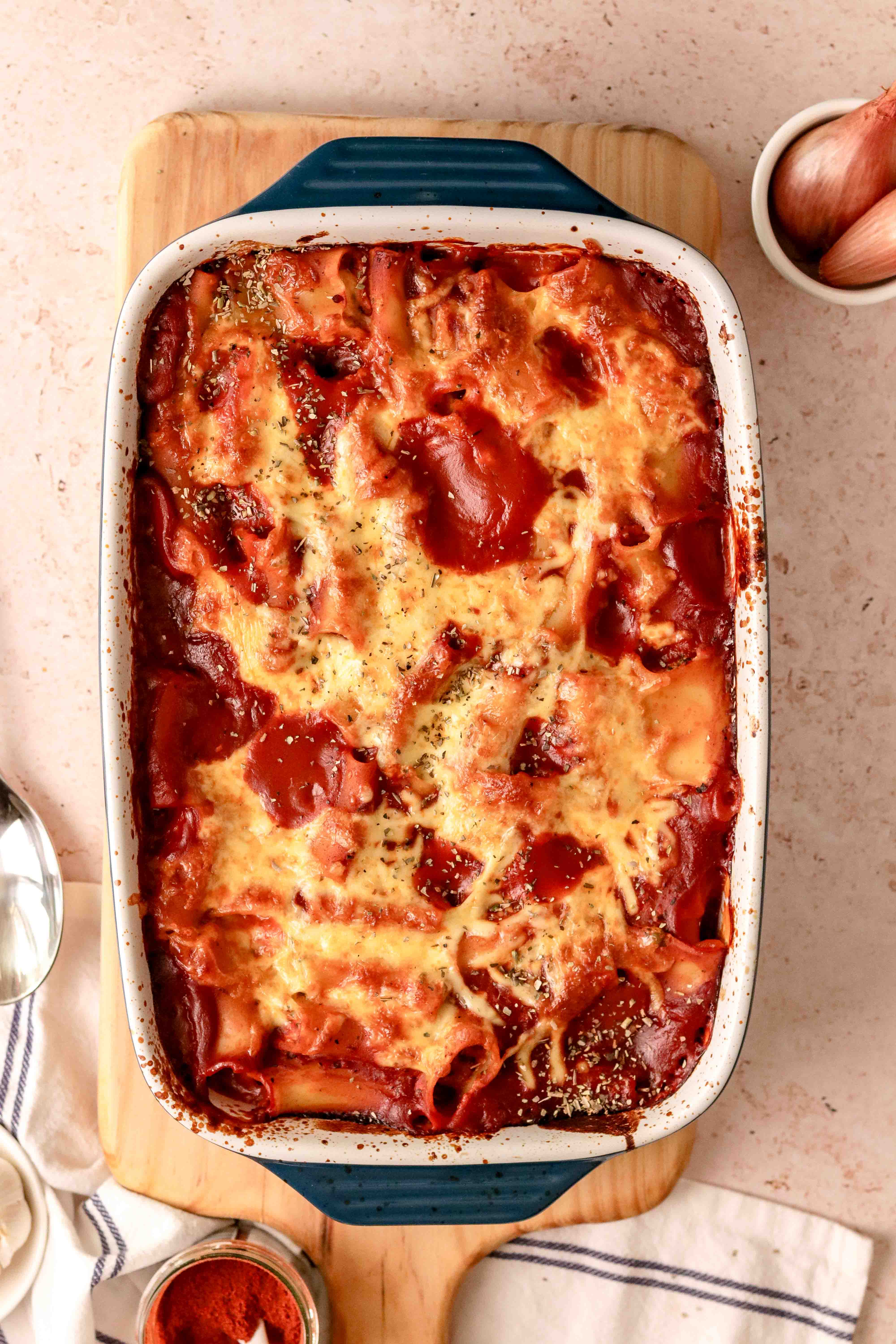 A tray of stuffed pasta in tomato sauce