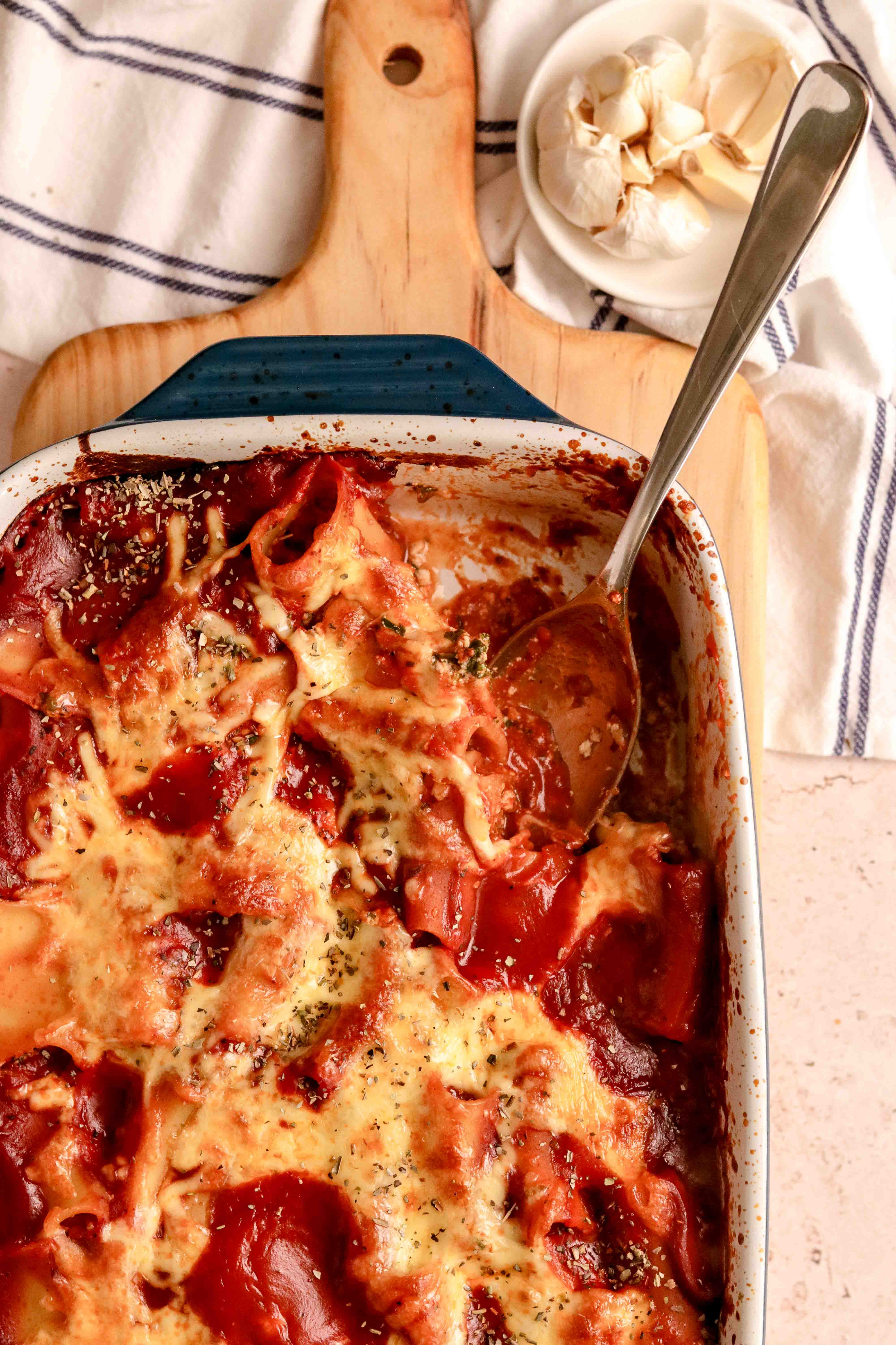 A tray of stuffed pasta in tomato sauce