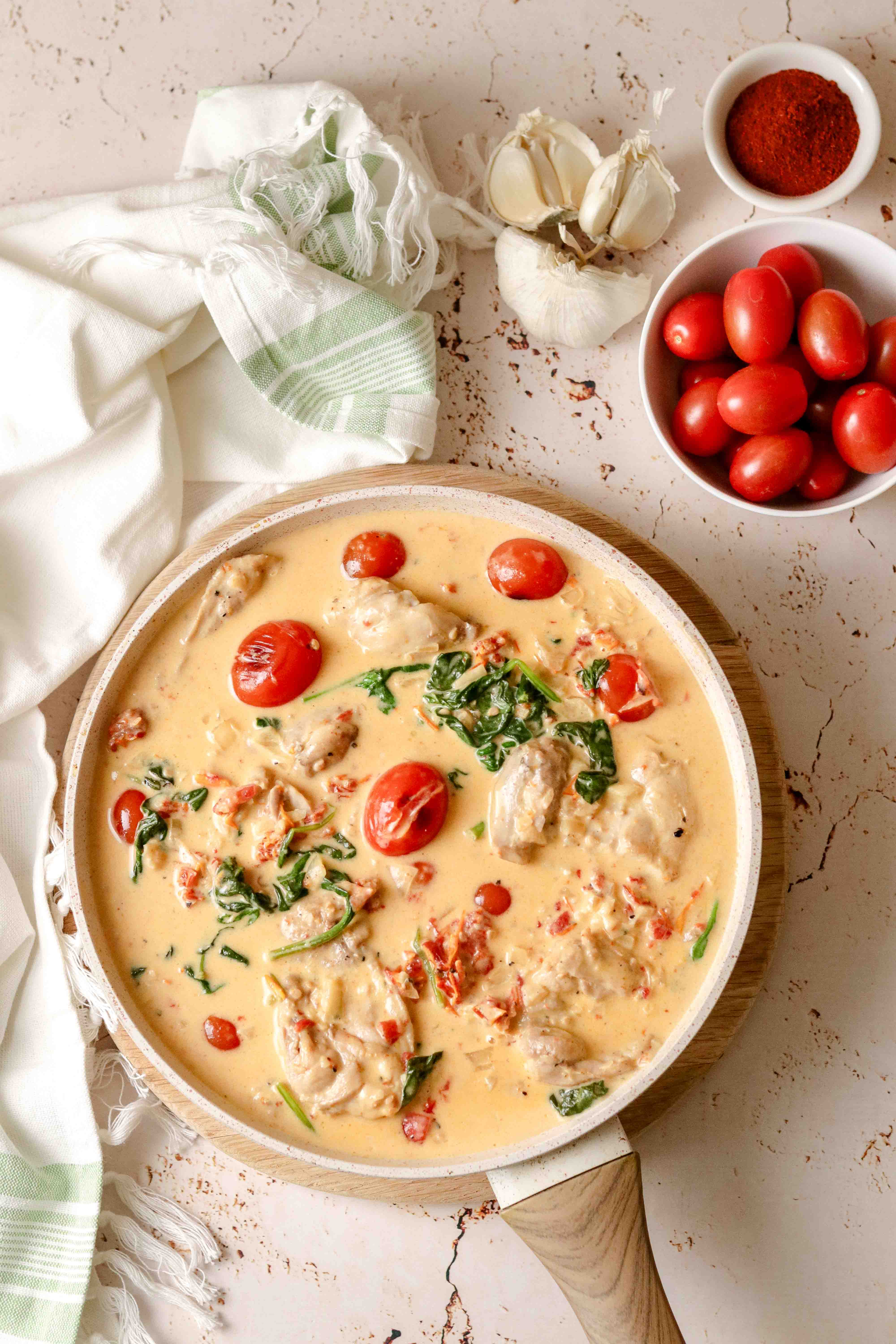 Pan of creamy chicken with tomatoes and parmesan