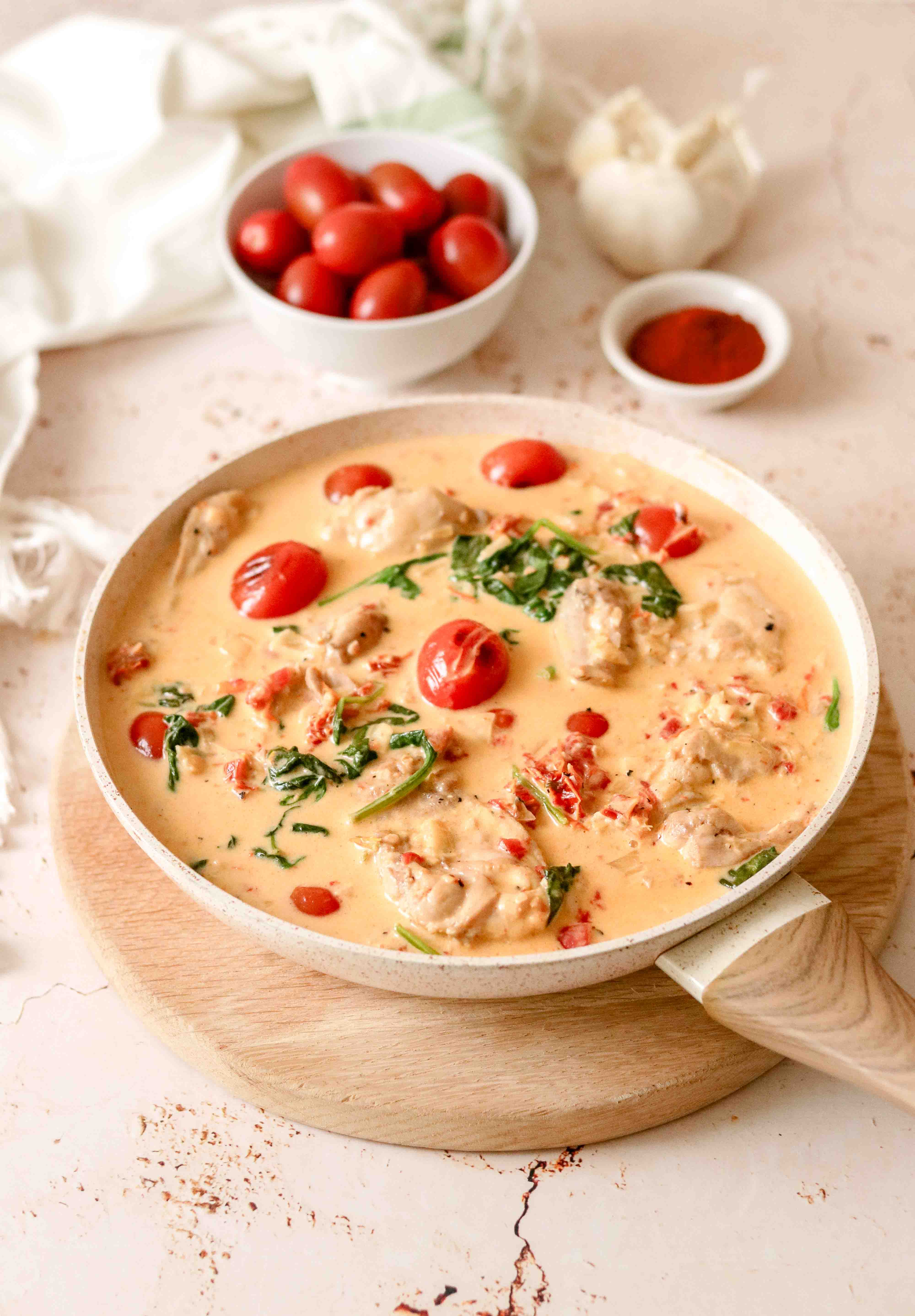 Pan of creamy chicken with tomatoes and parmesan