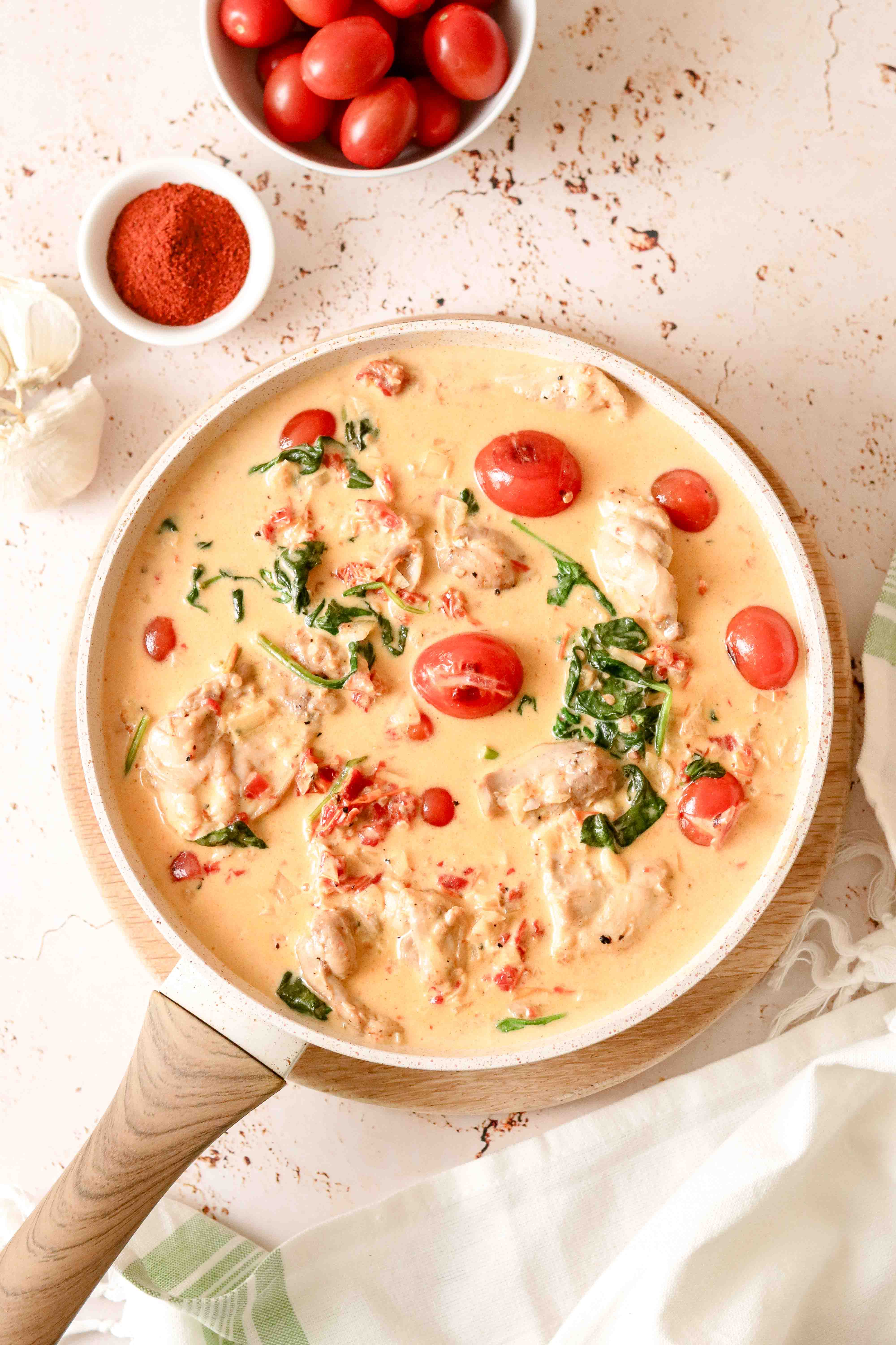 Pan of creamy chicken with tomatoes and parmesan