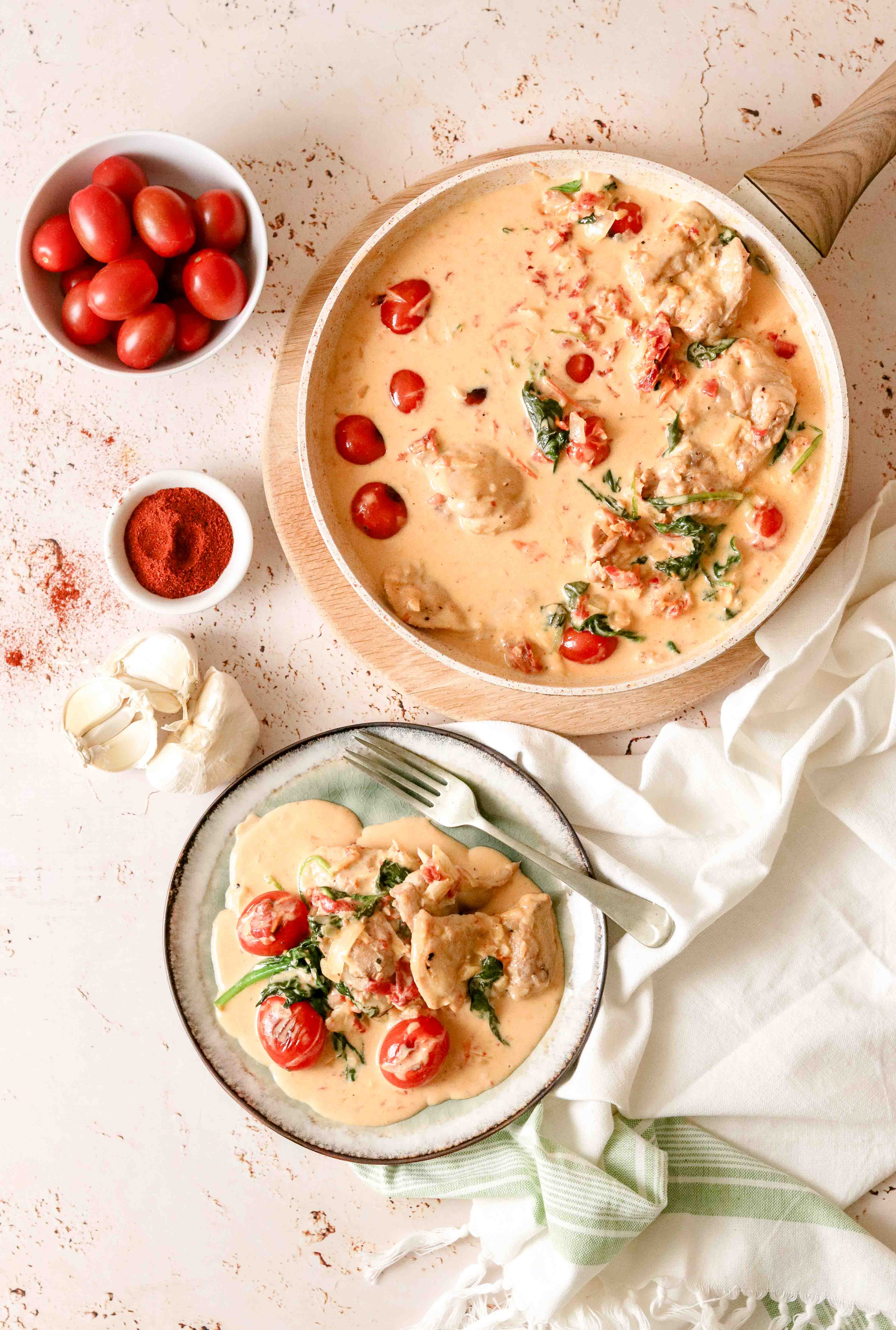 Pan of creamy chicken with tomatoes and parmesan