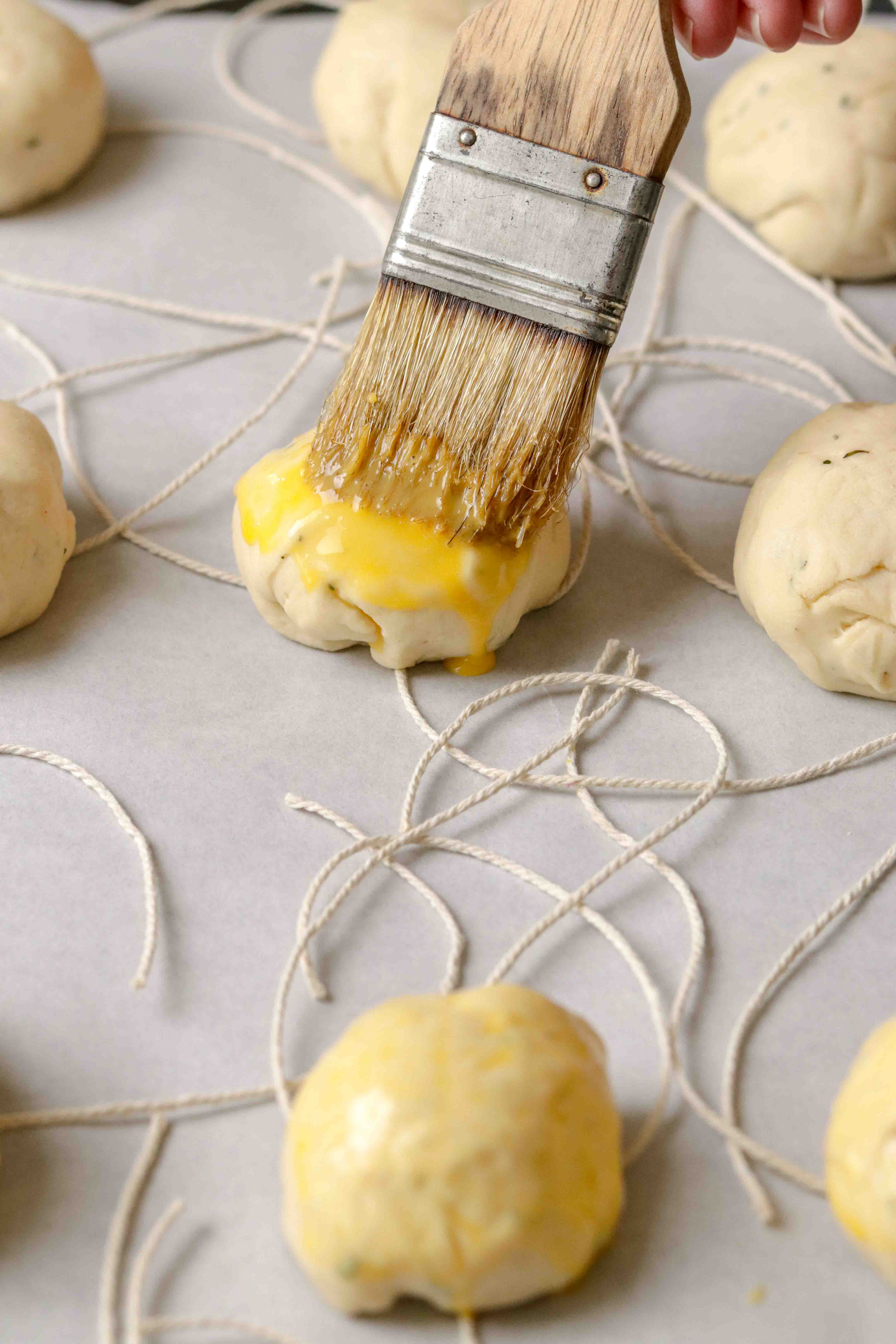 Glazing a brioche bun